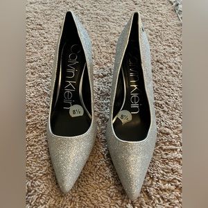 Calvin Klein, stiletto heels, color is silver with glitter, size 8.5